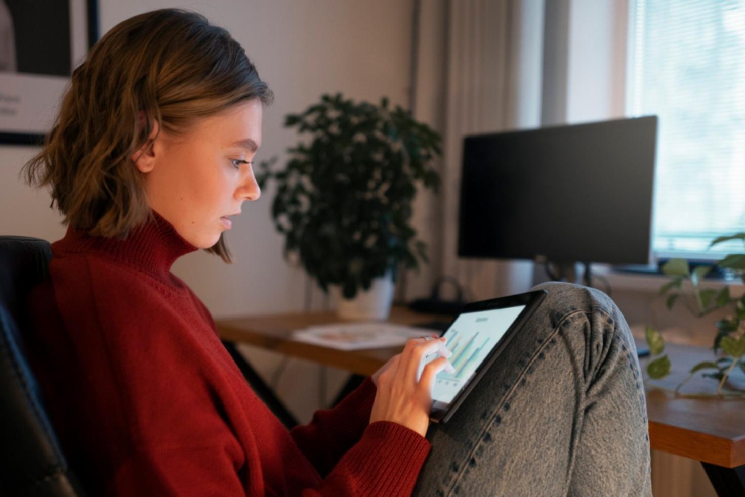 Analyst reviewing financial documents and data